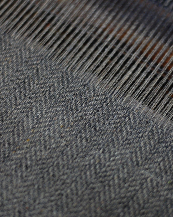 Weaving Recycled Herringbone material.jpg